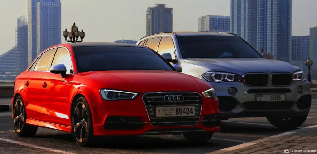 Two brand new cars parked on the road.